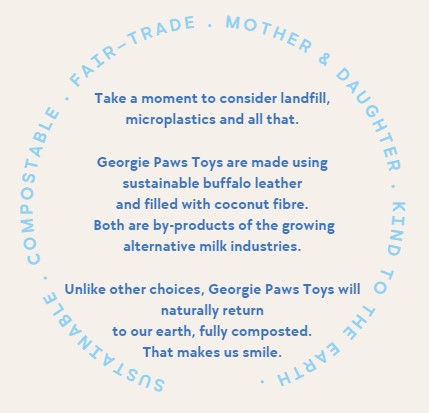 The image features a circular layout of text in a soft blue color with white text, discussing the sustainable and eco-friendly attributes of georgie paws toys, highlighting their composition from coconut fiber and their positive environmental impact.