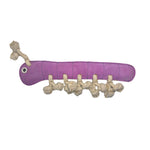 A purple, caterpillar-shaped dog toy with a smiling face, segmented body, and legs and antennae made from biodegradable coconut fibre. The toy has one eye, a curved mouth, and is designed for chewing and play. The product name is Gerti the Grub - purple by Georgie Paws.