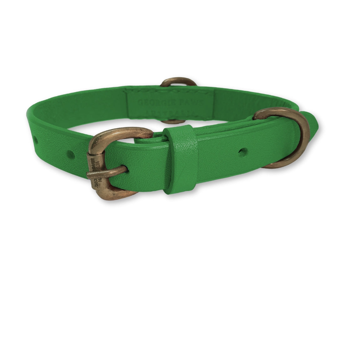 A vibrant green, hand-made Bald Collar Green dog collar with a brass buckle and d-ring, featuring a "George" name tag, isolated on a white background, suggesting pet personalization and style by Georgie Paws.