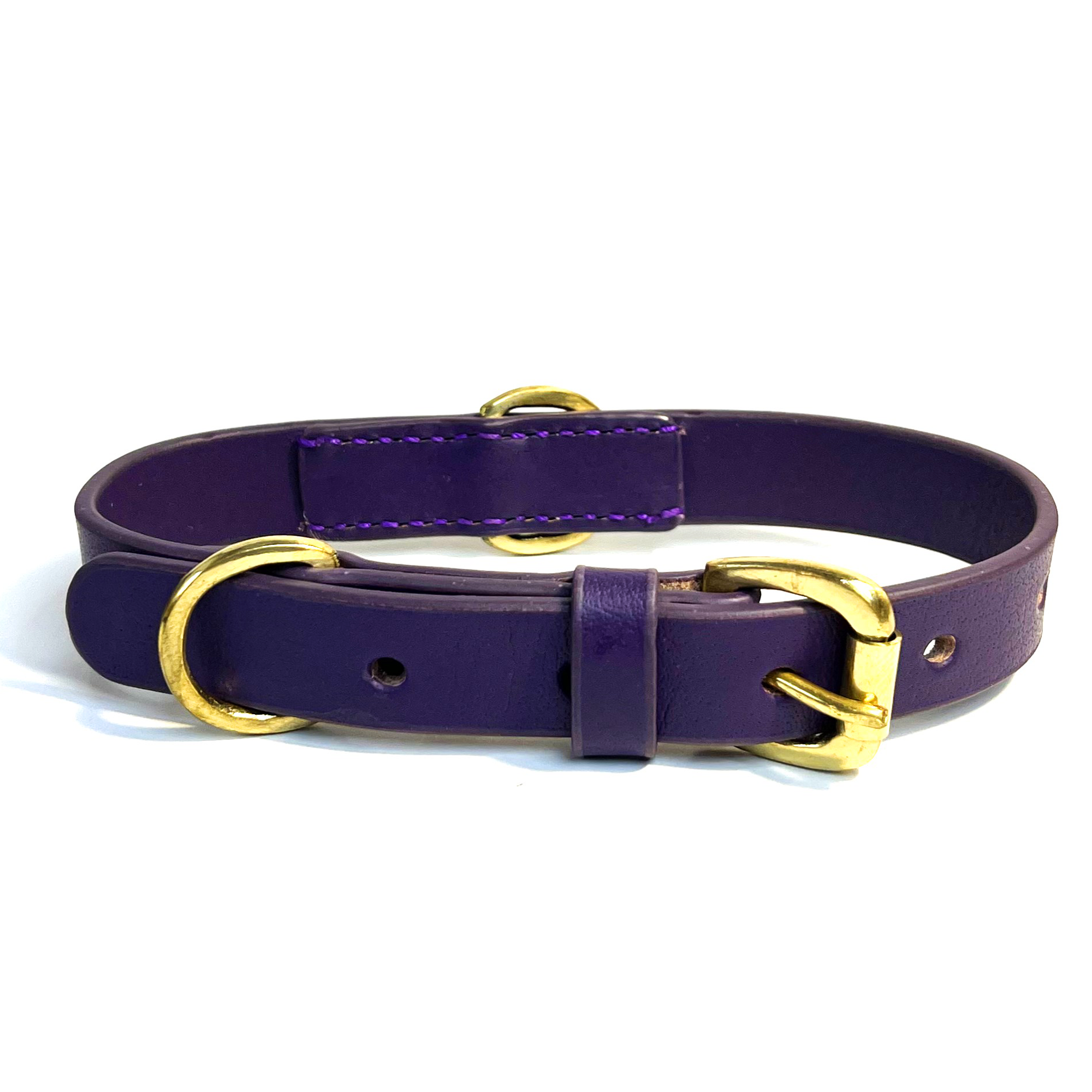 A hand-crafted Georgie Paws Bald Collar Purple with gold-tone hardware, featuring a buckle and d-ring, isolated on a white background.