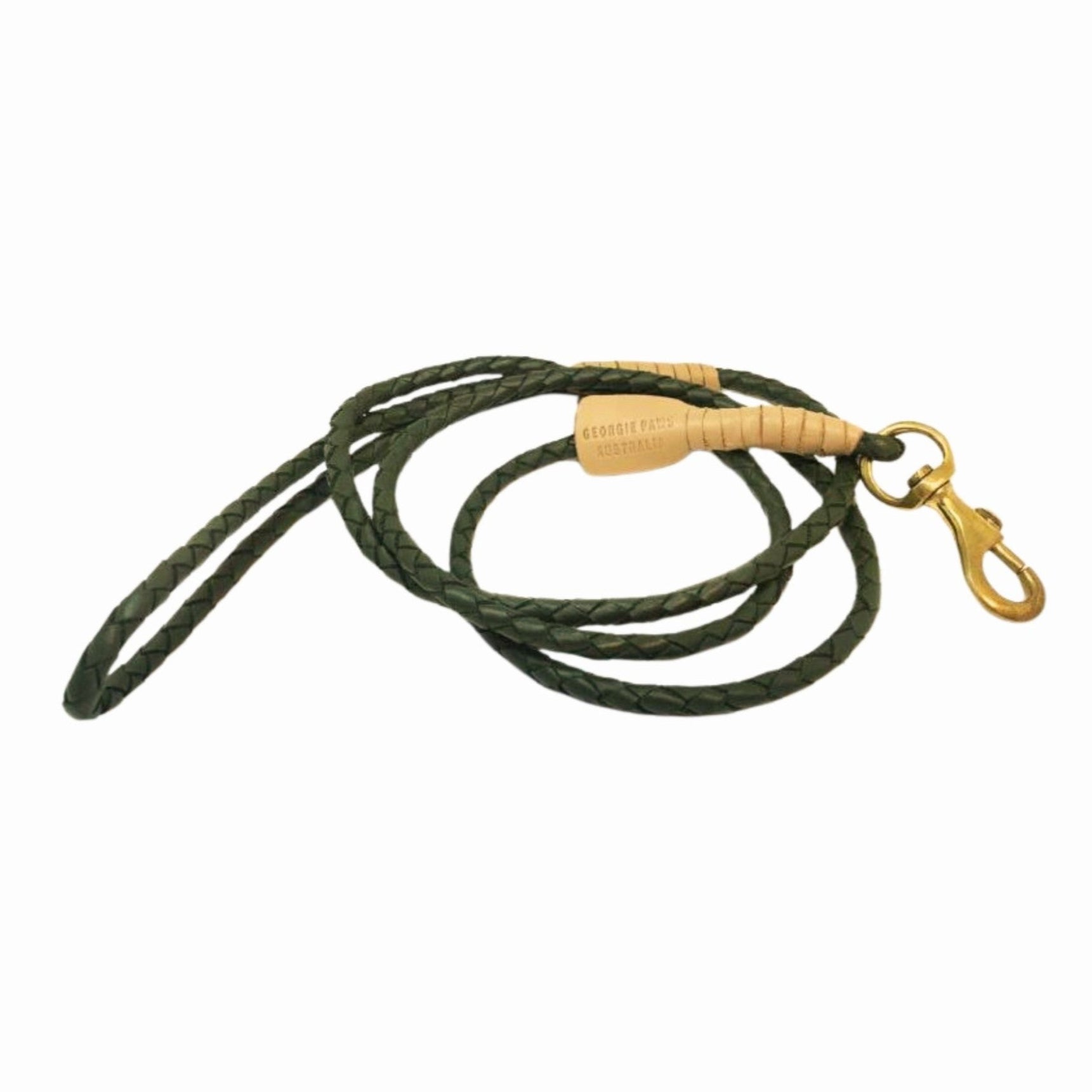 The Georgie Paws Windsor Lead - Chive is a dark green braided buffalo leather dog leash with tan leather-wrapped ends, handmade aged brass hardware, and a gold clasp, shown coiled loosely on a white background.