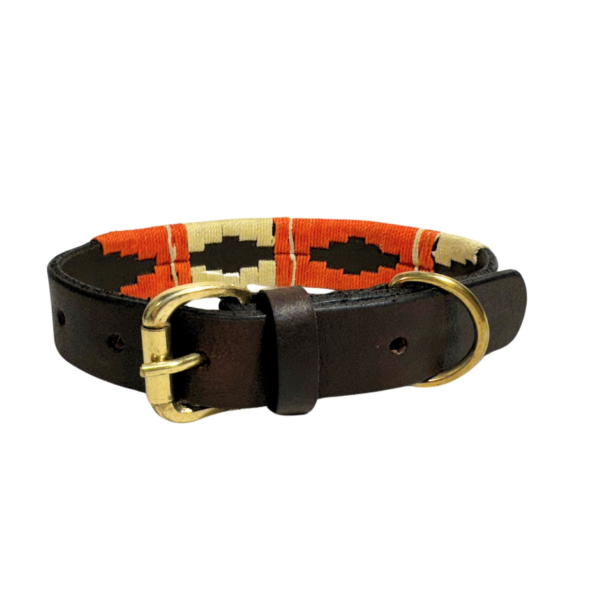 The Polo Collar - Angus by Georgie Paws is a handmade accessory that features intricate woven patterns in orange, black, and beige. Crafted from durable buffalo leather, it includes a brass buckle and D-ring for leash attachment, making it perfect for water-loving pups who need both style and versatility.