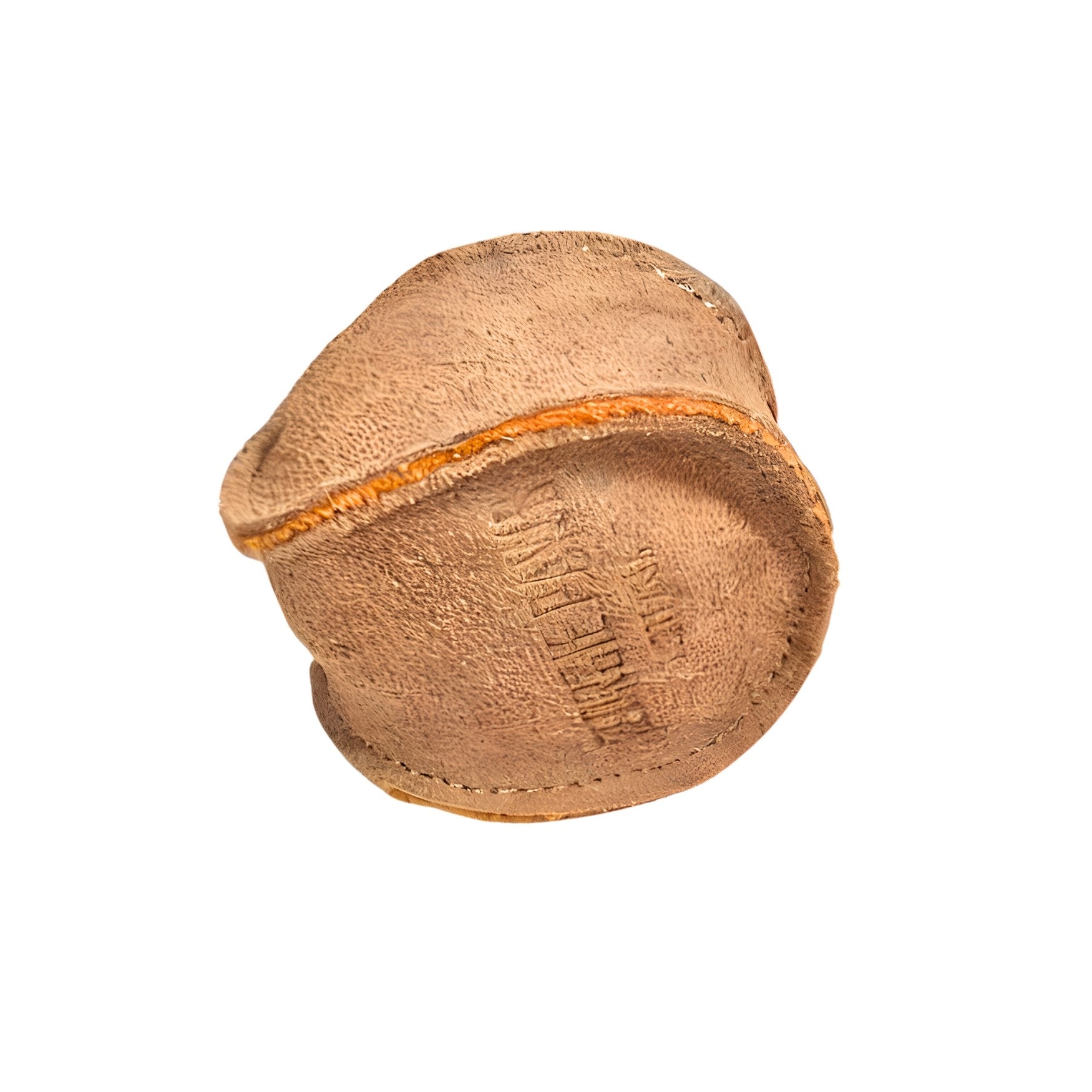 A well-worn Ball - Raw by Georgie Paws, crafted from brown leather with visible stitching. The surface is weathered and appears heavily used, adorned with faint markings and partially visible text. Resembling an eco-friendly dog ball, its seams are frayed, showing signs of significant wear and frequent handling. The rough texture further indicates its age and extensive use.