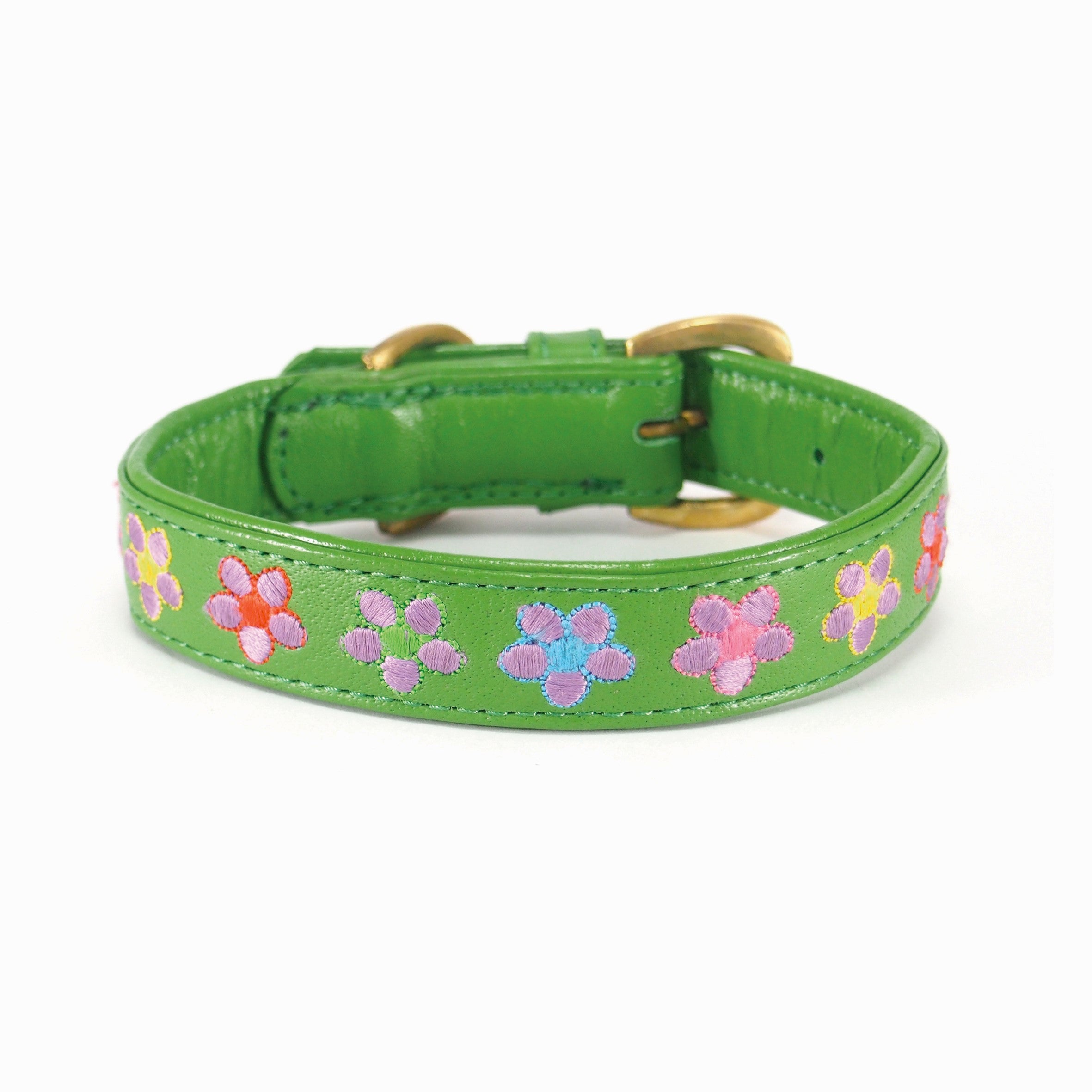 A Botanic Basil Collar from Georgie Paws, made of green buffalo leather and adorned with embroidered flower patterns, featuring a gold-tone buckle and loop, isolated on a white background.