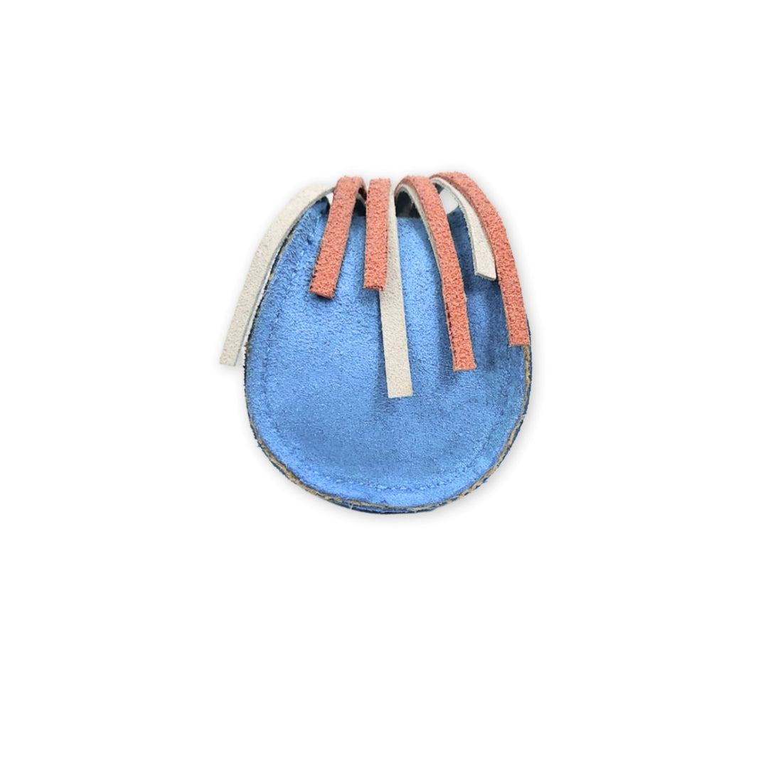 A Georgie Paws Bobble Sea Urchin - blue, a colorful abstract fabric art piece with blue, grey, and pink hues, resembling a stylized circular form with ribbons or loops on a white background crafted from eco-friendly pet toy materials.