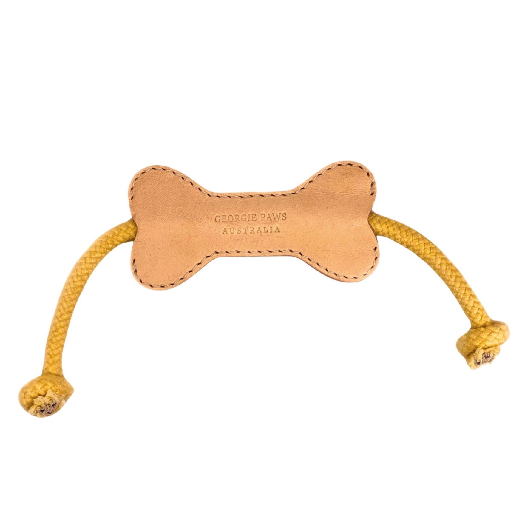 A Flora Bone Toy - Natural with the brand "Georgie Paws" embossed in the center, featuring a simple stitched design and two knotted ropes attached for added playtime fun.