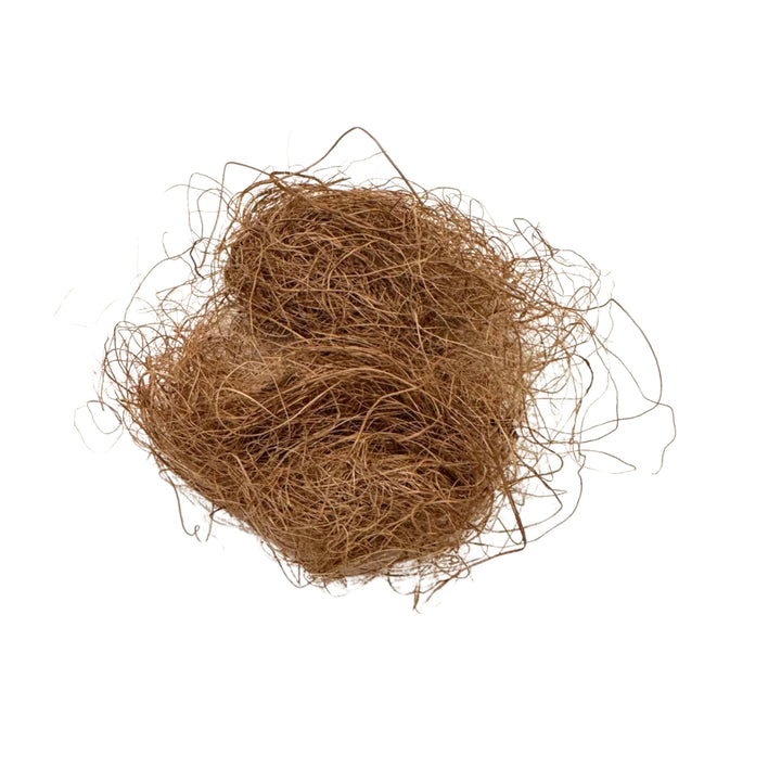 A loose, tangled bundle of thin, brown coconut coir fibers is shown on a white background. This eco-friendly material features irregularly arranged strands that create a messy nest-like appearance, with fibers sticking out in various directions.