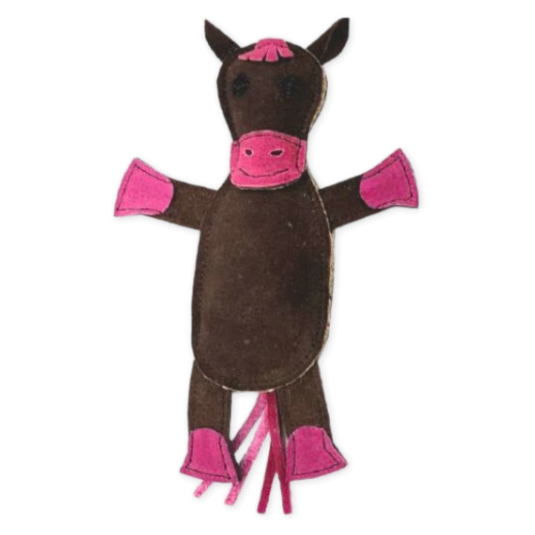 A handmade, Georgie Paws-styled eco-friendly dog toy representing a cow, colored in brown with pink accents on the hooves, ears, and snout, isolated on a white background.