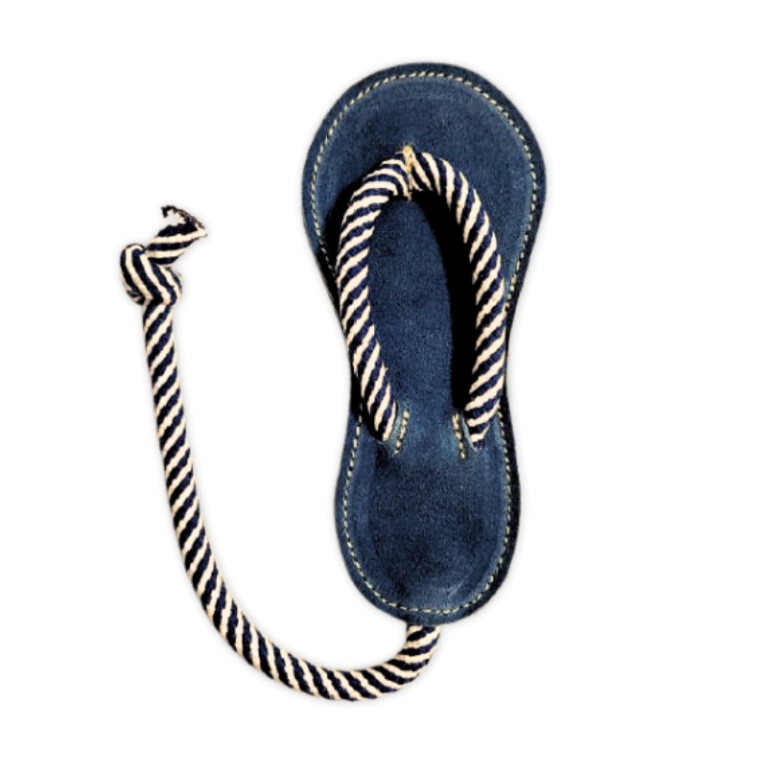 A single Georgie Paws navy blue Jandal with white stripes, featuring a rope-style strap, designed as an earth-friendly chew toy for puppies, isolated on a white background, presenting a nautical theme.