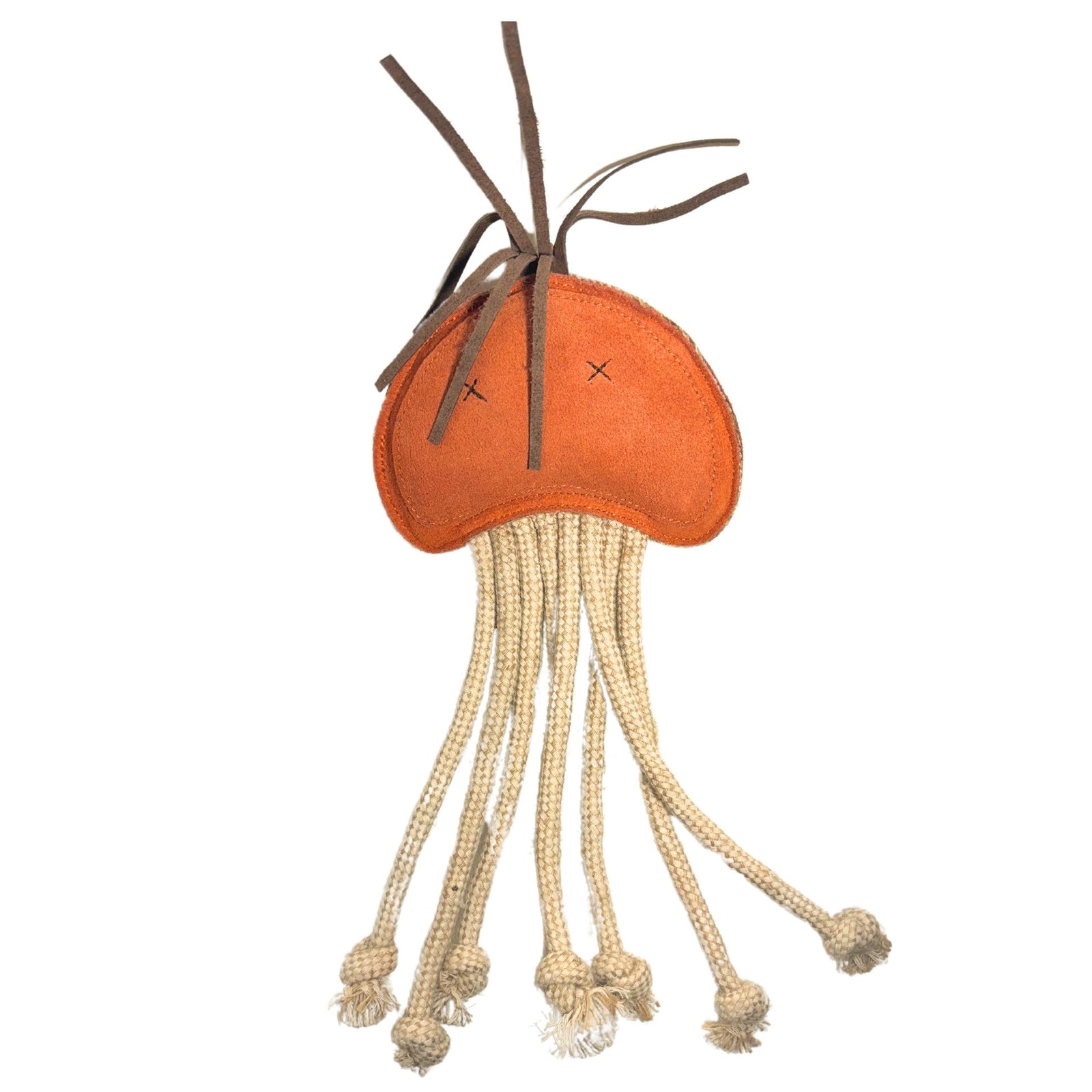 A plush orange jellyfish toy with a stitched face featuring two X eyes. Long, cream-colored rope tentacles hang from the bottom, some ending in knots. Brown strings resembling tendrils stick out from the top. Crafted using sustainable materials, it offers a natural charm against a plain white background.