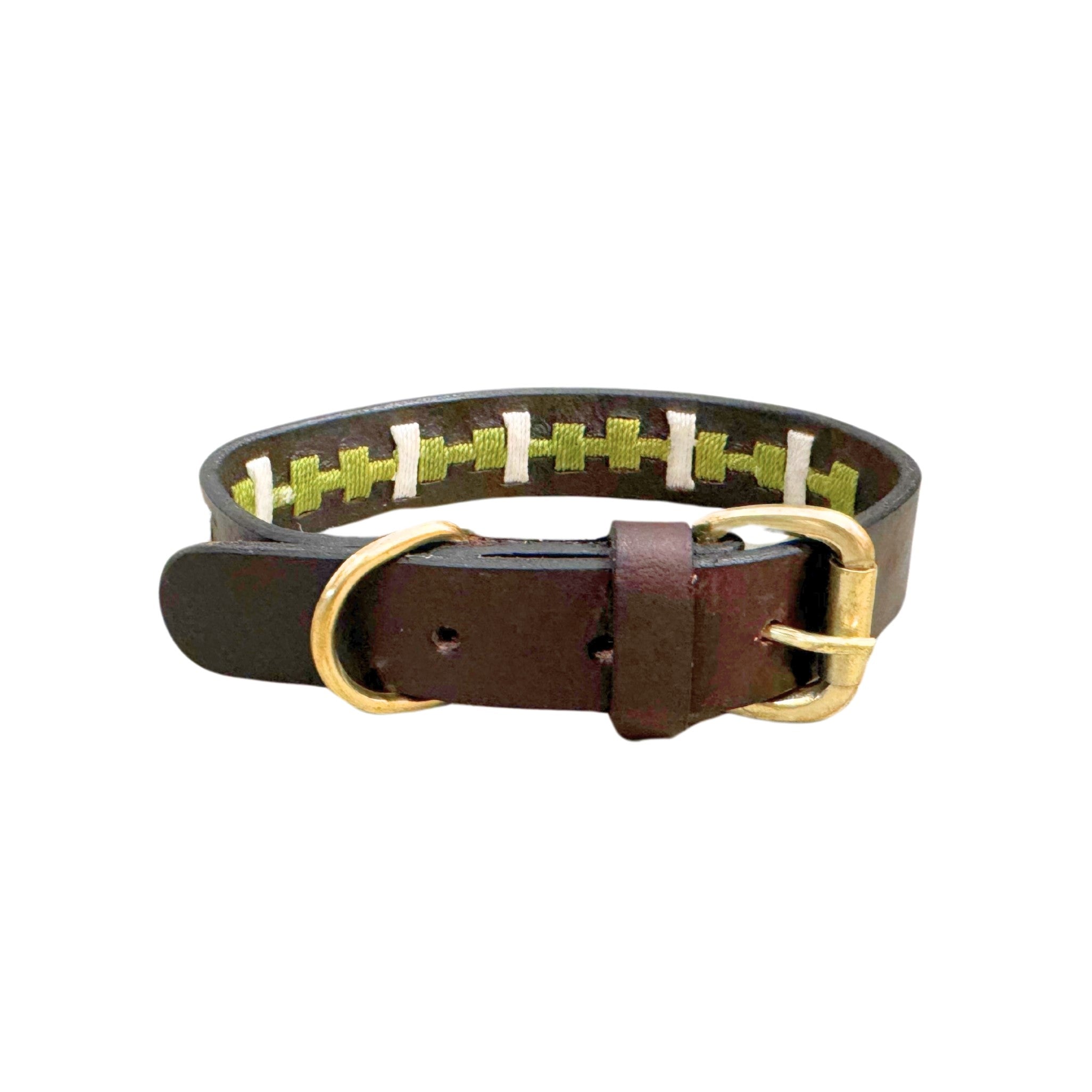 The Polo Collar - Lokki green by Georgie Paws is a luxurious brown buffalo leather dog collar, featuring brass hardware. The inside showcases a woven pattern with alternating green and white threads. The collar's belt-style buckle and D-ring are shiny and sturdy, enhancing the rustic design perfect for small to medium dogs.