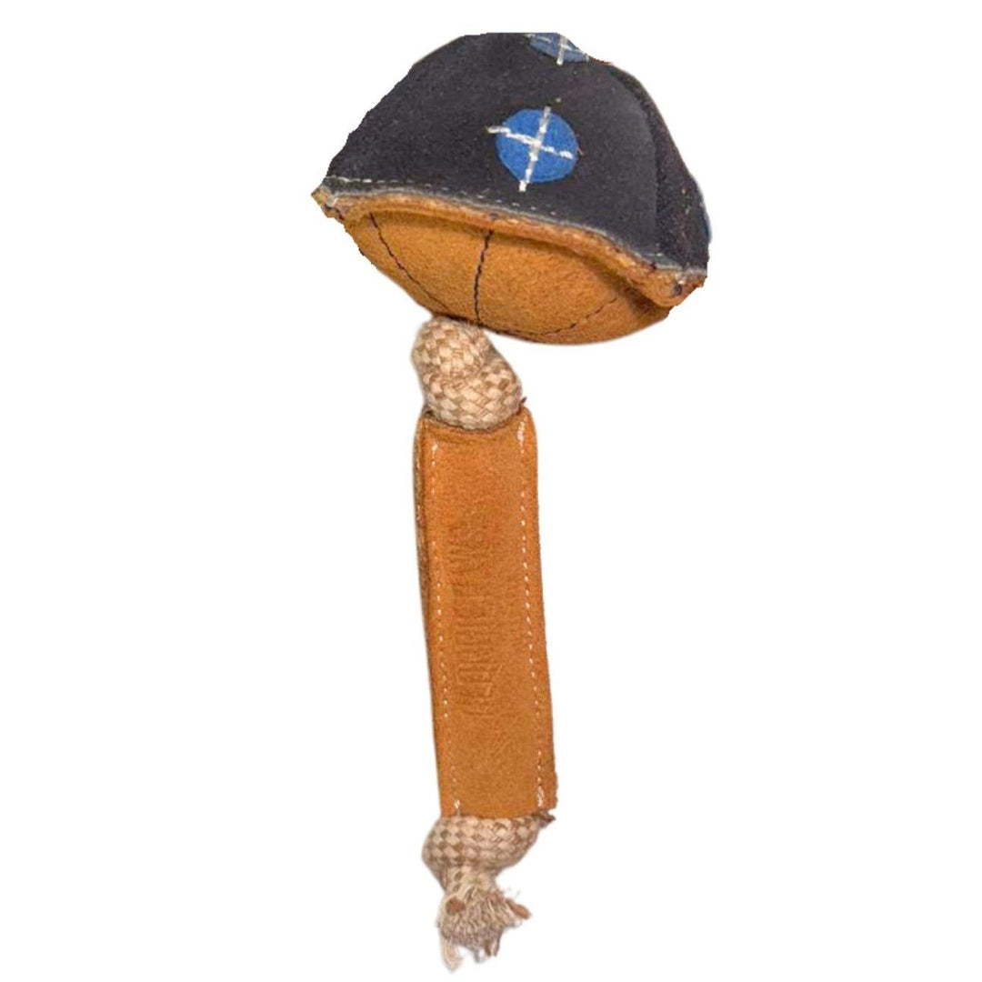Maisy the Mushroom Dog Toy - Blue by Georgie Paws is a handcrafted dog toy shaped like a mushroom, featuring a brown, textured stem with knotted fabric ends for a natural touch and a dark cap adorned with blue and white X patterns.
