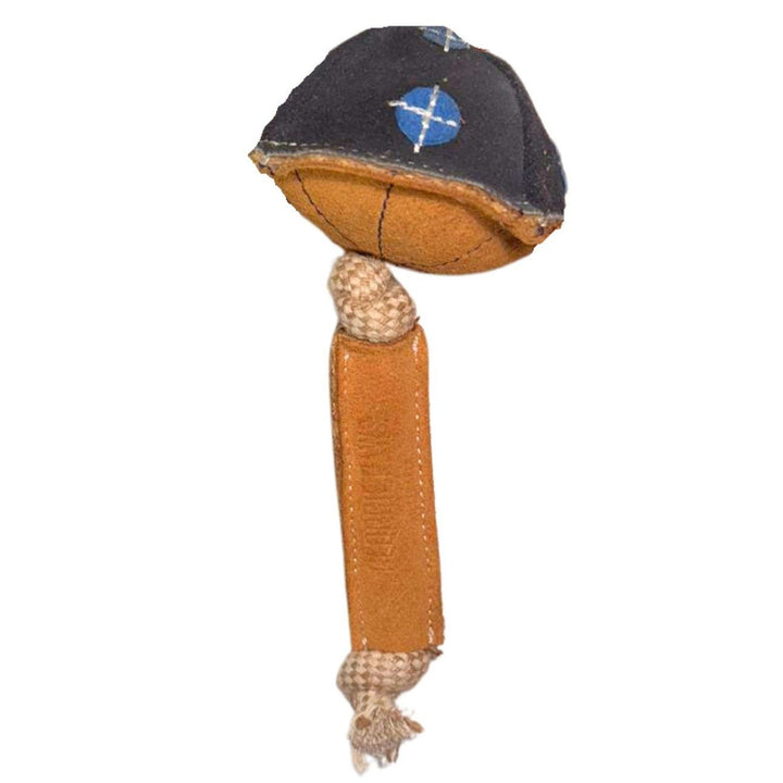 Maisy the Mushroom Dog Toy - Blue by Georgie Paws is a handcrafted dog toy shaped like a mushroom, featuring a brown, textured stem with knotted fabric ends for a natural touch and a dark cap adorned with blue and white X patterns.