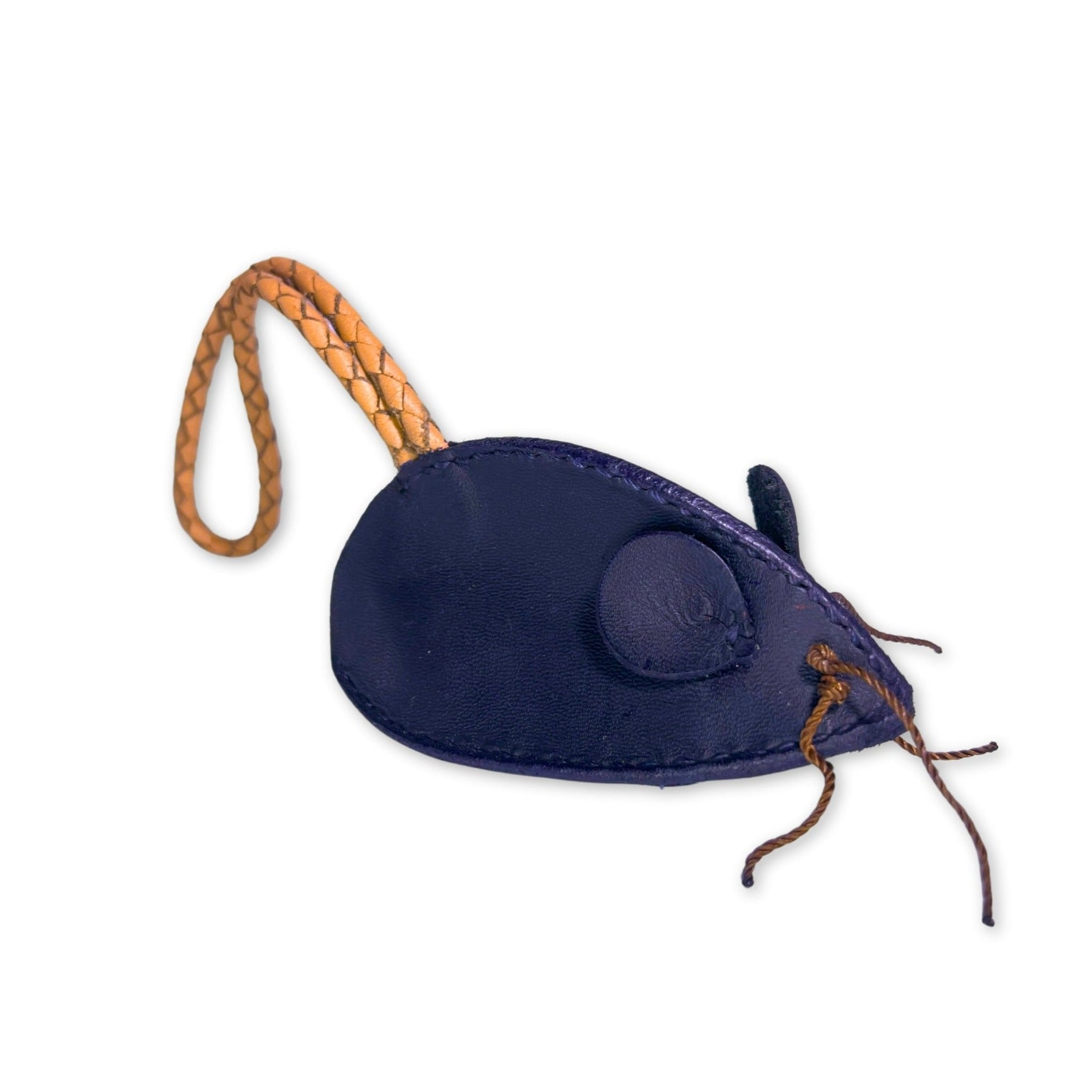 A whimsical Georgie Paws navy blue leather Mouse Poobag Dispenser with a braided leather tail and charming stitch detail, designed to hold poo bags, isolated on a white background.
