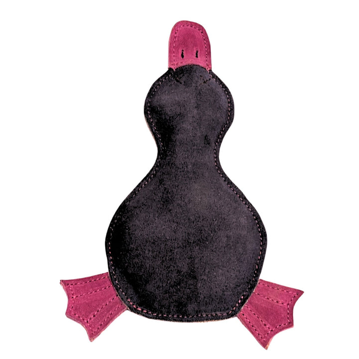 Paul the Platypus - Navy by Georgie Paws is a natural, handmade felt toy shaped like a platypus, featuring a black body with magenta head, bill, and webbed feet. Shown against a white background, its visible edge stitching enhances the artisanal look, while two small black dots on the bill serve as nostrils.