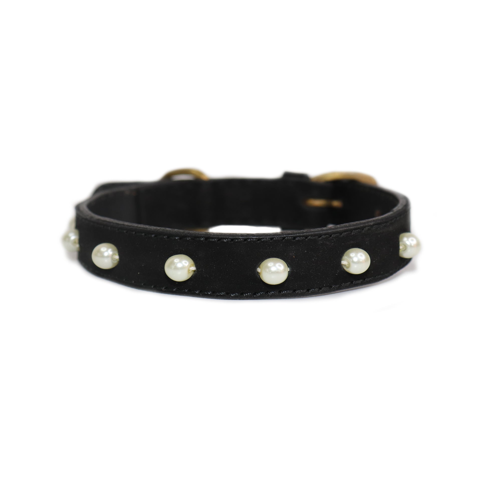 The Pearl Collar - Black by Georgie Paws is a sophisticated dog collar made from buffalo leather, elegantly adorned with evenly spaced white pearls along its length. It features metal hardware, including a shiny silver buckle, enhancing its stylish appearance against a plain white background.