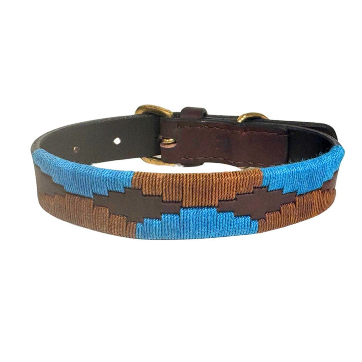 Introducing the Polo Collar - Stubble by Georgie Paws: a handmade leather dog collar featuring a stitched blue and brown geometric zigzag pattern along the center, complete with brass hardware and adjustable holes.