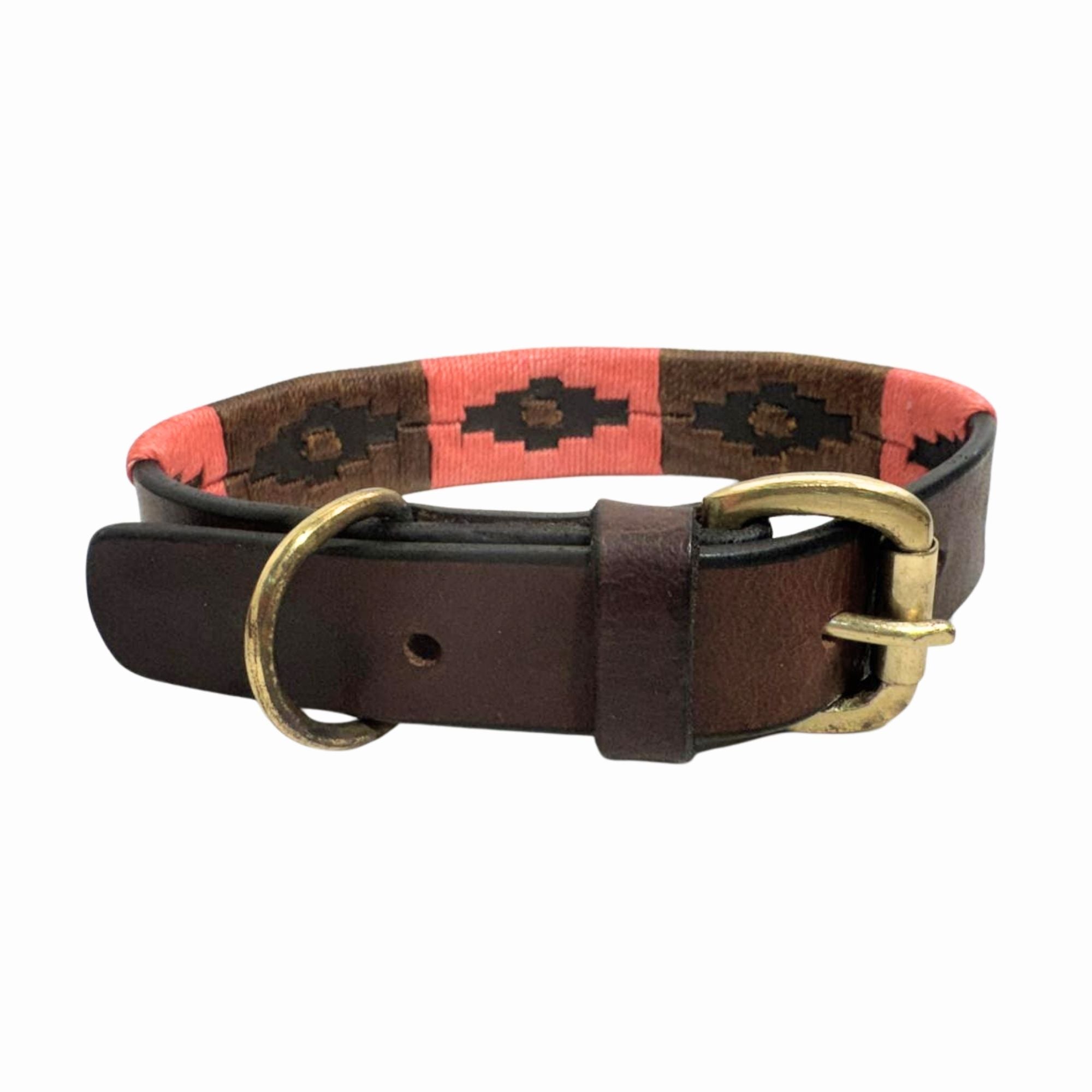 The Georgie Paws Polo Collar - Poppy is a handmade buffalo leather dog collar with a brass buckle and ring, featuring a stitched pink and brown geometric pattern on classic leather. Shown against a plain white background.