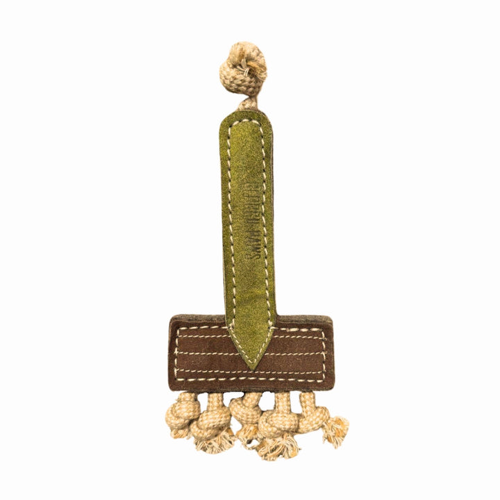 The Ready Rake Dog Toy by Georgie Paws features a brown base, green center stripe, beige decorative knots, and a beige cord loop—designed like a stylish rope tug toy—shown on a white background.