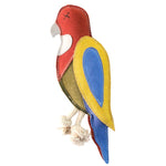 Rick the Rosella by Georgie Paws is a plush parrot toy featuring a red head, white beak with "X" eyes, yellow and blue wings, green body, blue tail, and two knotted rope legs. Made with natural materials and visible stitching.