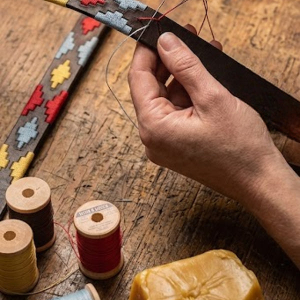 Fairly paid artisans handmaking dog collars and leads
