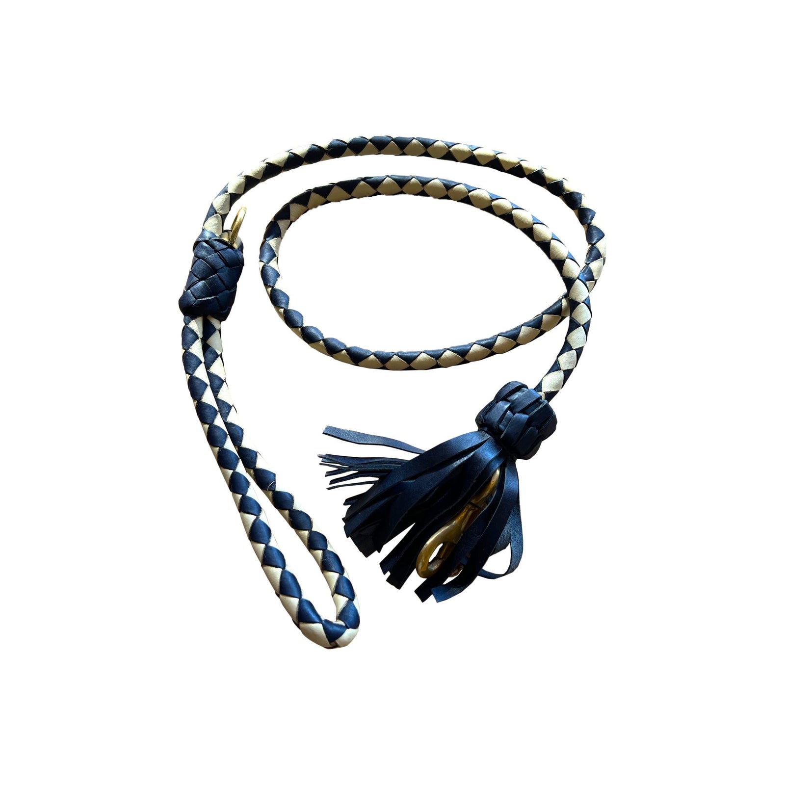 The Swanky Lead - Navy by Georgie Paws, handmade from vegetable tanned buffalo leather, features a navy and beige braided design. It is coiled on a white background, showcasing its looped handle at one end and a decorative knot with leather tassels at the other.
