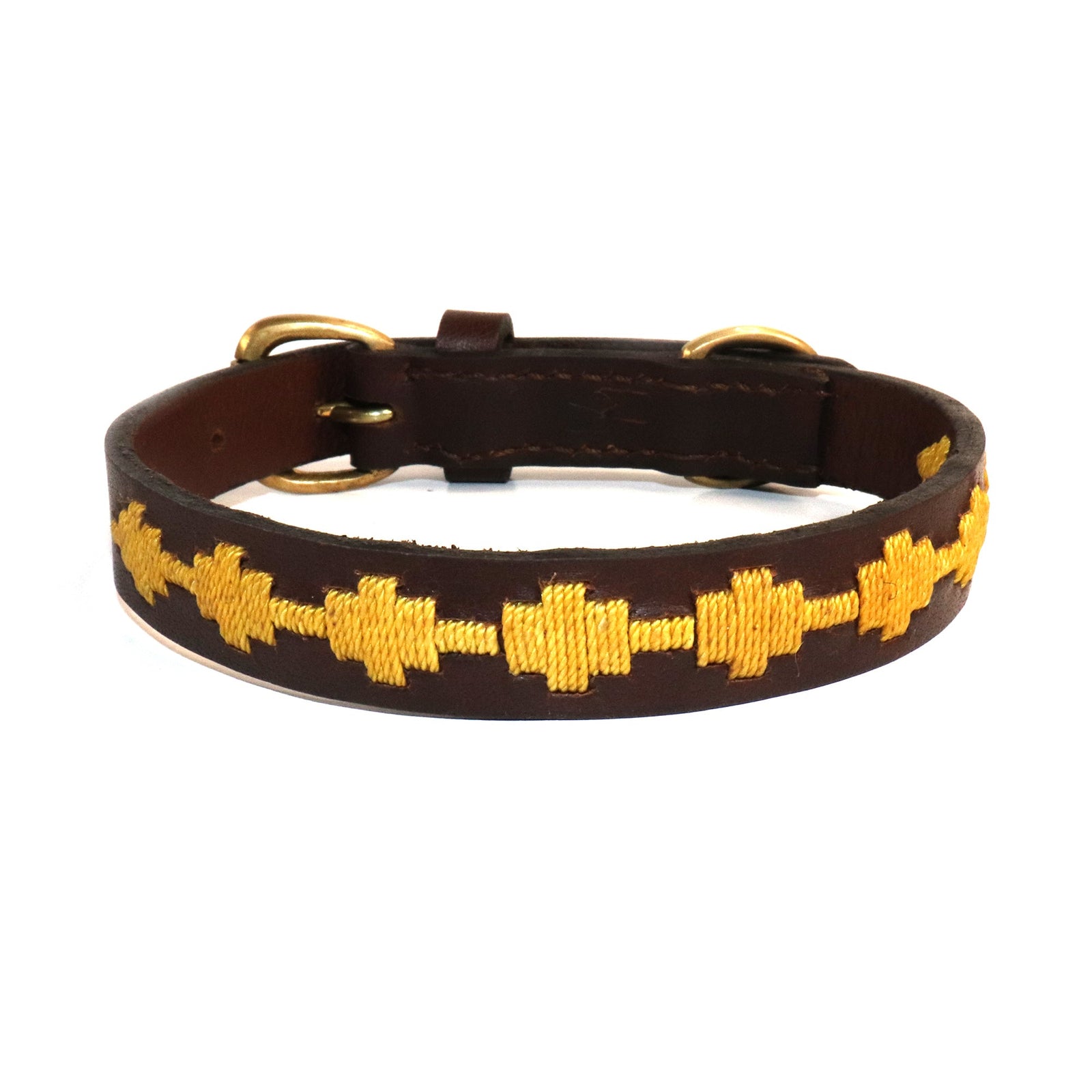 The Georgie Paws Polo Bark Collar - Wheat, made from rich brown buffalo leather, features a handmade pattern of yellow embroidered alternating plus signs along with a metal buckle and two D-rings for fastening.