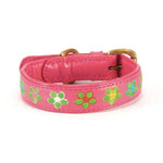 A cute botanic lotus collar by Georgie Paws adorned with colorful flowers, serving as a chewtoy.