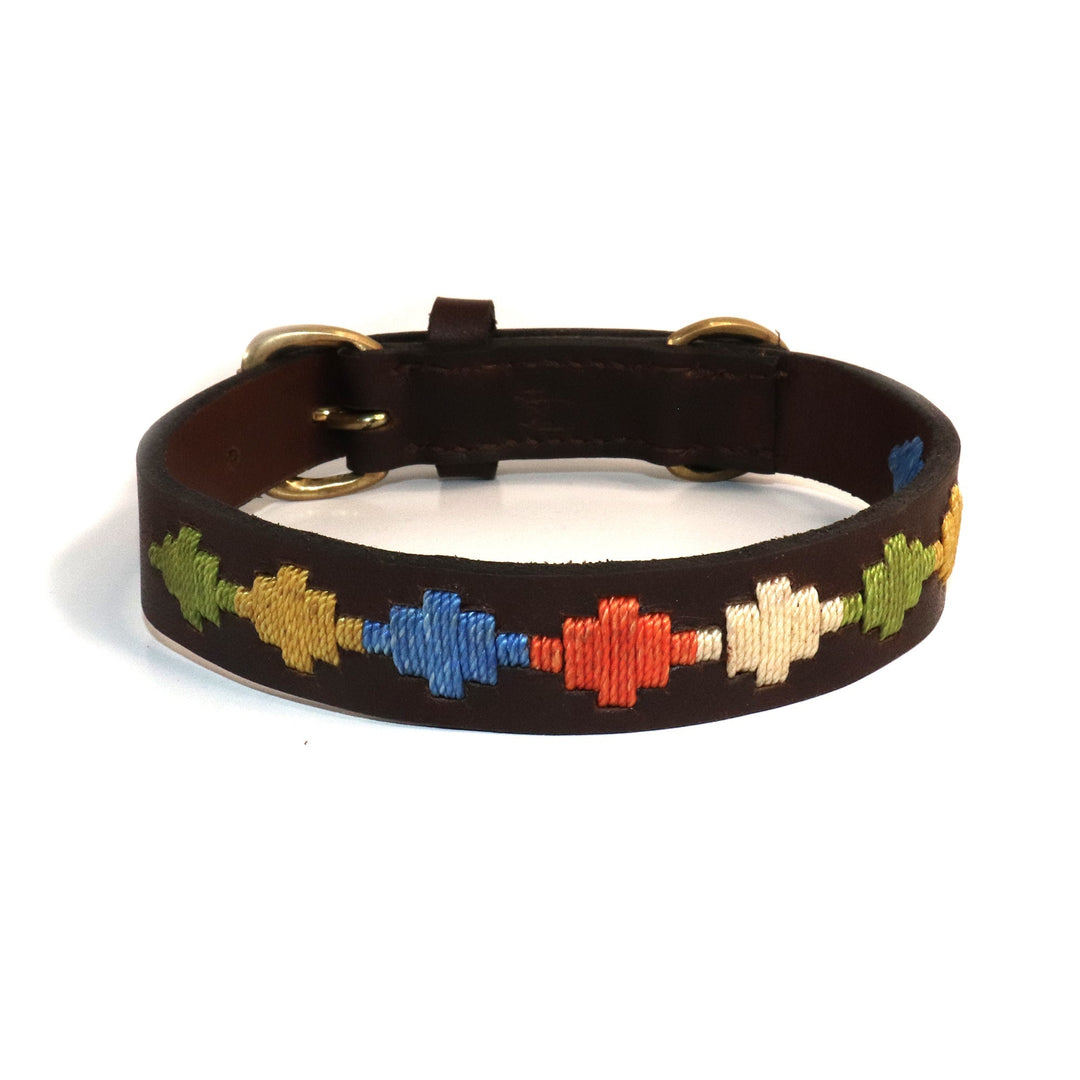 Introducing the Polo Collar - Arvo by Georgie Paws: a dark brown, handmade dog collar crafted from sustainable vegetable-tanned buffalo leather. This sturdy collar features gold metal buckles and displays a repeating pattern of embroidered geometric shapes in green, yellow, blue, red, cream, and orange.