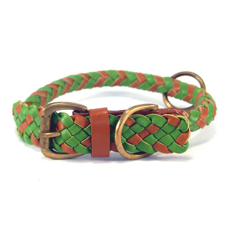 Introducing the Tonto Collar - Green by Georgie Paws: expertly handcrafted from strips of natural green and brown vegetable-tanned buffalo leather, this collar is braided into a distinctive woven pattern and finished with sturdy brass buckles and rings. Its looped design offers a stylish yet durable accessory for your pet.